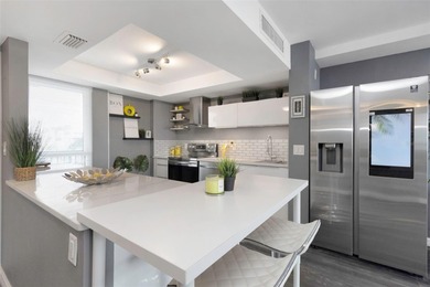 Stunning Resort-Style Condo with Designer Finishes and on Cove Cay Country Club in Florida - for sale on GolfHomes.com, golf home, golf lot