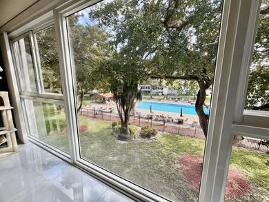 WELCOME to easy FLORIDA living in this uniquely enhanced 2/2 on Wynmoor Golf Course in Florida - for sale on GolfHomes.com, golf home, golf lot