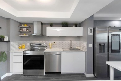 Stunning Resort-Style Condo with Designer Finishes and on Cove Cay Country Club in Florida - for sale on GolfHomes.com, golf home, golf lot