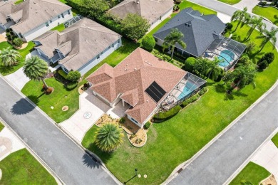 POOL HOME with GOLF CART GARAGE. On a desirable corner lot in on The Links of Spruce Creek in Florida - for sale on GolfHomes.com, golf home, golf lot