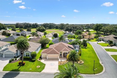 POOL HOME with GOLF CART GARAGE. On a desirable corner lot in on The Links of Spruce Creek in Florida - for sale on GolfHomes.com, golf home, golf lot