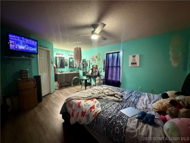 Discover the perfect blend of space, comfort, and privacy in on Oak Hills Country Club in Missouri - for sale on GolfHomes.com, golf home, golf lot