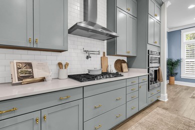 Step inside this impressive three-story residence in the on Dunes West Golf Club in South Carolina - for sale on GolfHomes.com, golf home, golf lot