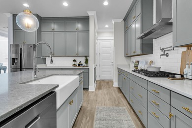 Step inside this impressive three-story residence in the on Dunes West Golf Club in South Carolina - for sale on GolfHomes.com, golf home, golf lot