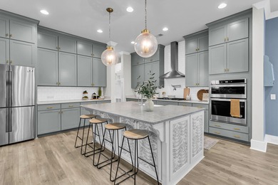 Step inside this impressive three-story residence in the on Dunes West Golf Club in South Carolina - for sale on GolfHomes.com, golf home, golf lot