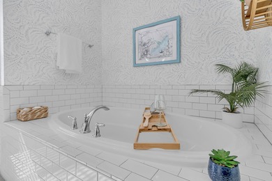 Step inside this impressive three-story residence in the on Dunes West Golf Club in South Carolina - for sale on GolfHomes.com, golf home, golf lot