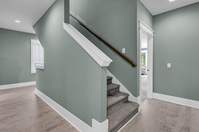 Step inside this impressive three-story residence in the on Dunes West Golf Club in South Carolina - for sale on GolfHomes.com, golf home, golf lot