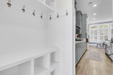 Step inside this impressive three-story residence in the on Dunes West Golf Club in South Carolina - for sale on GolfHomes.com, golf home, golf lot