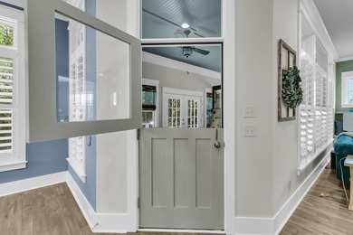 Step inside this impressive three-story residence in the on Dunes West Golf Club in South Carolina - for sale on GolfHomes.com, golf home, golf lot