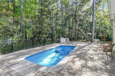 Step inside this impressive three-story residence in the on Dunes West Golf Club in South Carolina - for sale on GolfHomes.com, golf home, golf lot