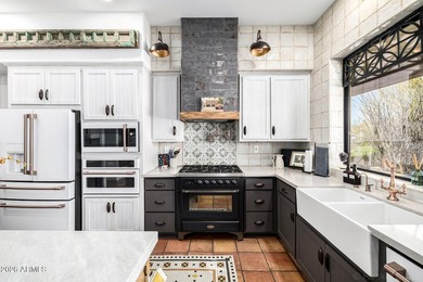 Welcome to tranquility. Step into your stunning custom home in on Troon Country Club in Arizona - for sale on GolfHomes.com, golf home, golf lot