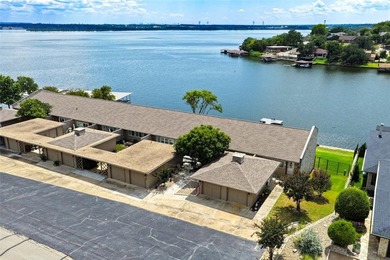 Enjoy lakefront living in this charming 2 bedroom, 1.5 bath on De Cordova Bend Country Club in Texas - for sale on GolfHomes.com, golf home, golf lot