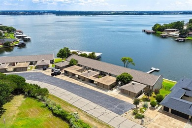 Enjoy lakefront living in this charming 2 bedroom, 1.5 bath on De Cordova Bend Country Club in Texas - for sale on GolfHomes.com, golf home, golf lot