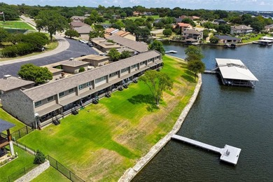 Enjoy lakefront living in this charming 2 bedroom, 1.5 bath on De Cordova Bend Country Club in Texas - for sale on GolfHomes.com, golf home, golf lot