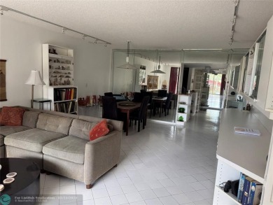 Convenient first floor unit condo in the tropical Palm Aire on Palm-Aire Country Club and Resort - The Oaks in Florida - for sale on GolfHomes.com, golf home, golf lot