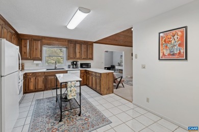 Step inside this one-level 3 bedroom, 2.5 bath Mid-Century on Lake Monticello Golf Course in Virginia - for sale on GolfHomes.com, golf home, golf lot