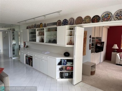 Convenient first floor unit condo in the tropical Palm Aire on Palm-Aire Country Club and Resort - The Oaks in Florida - for sale on GolfHomes.com, golf home, golf lot