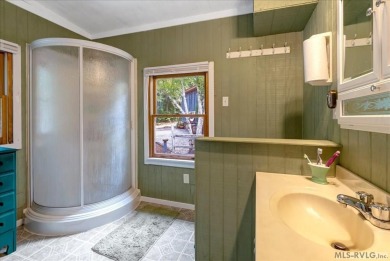 Cozy and character-filled nestled in a quiet lake community just on River Ridge Golf Club in Virginia - for sale on GolfHomes.com, golf home, golf lot