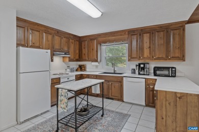 Step inside this one-level 3 bedroom, 2.5 bath Mid-Century on Lake Monticello Golf Course in Virginia - for sale on GolfHomes.com, golf home, golf lot