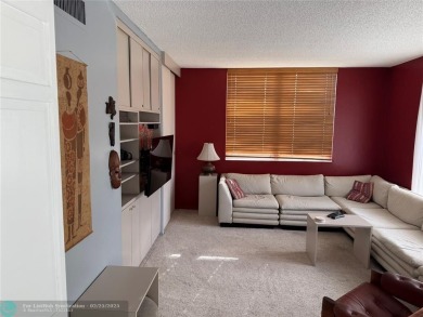 Convenient first floor unit condo in the tropical Palm Aire on Palm-Aire Country Club and Resort - The Oaks in Florida - for sale on GolfHomes.com, golf home, golf lot