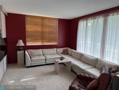 Convenient first floor unit condo in the tropical Palm Aire on Palm-Aire Country Club and Resort - The Oaks in Florida - for sale on GolfHomes.com, golf home, golf lot