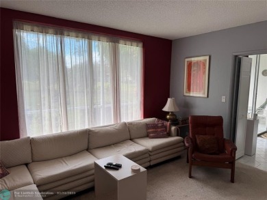 Convenient first floor unit condo in the tropical Palm Aire on Palm-Aire Country Club and Resort - The Oaks in Florida - for sale on GolfHomes.com, golf home, golf lot