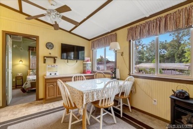 Cozy and character-filled nestled in a quiet lake community just on River Ridge Golf Club in Virginia - for sale on GolfHomes.com, golf home, golf lot