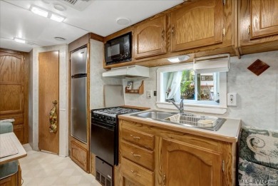 Cozy and character-filled nestled in a quiet lake community just on River Ridge Golf Club in Virginia - for sale on GolfHomes.com, golf home, golf lot