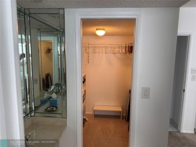 Convenient first floor unit condo in the tropical Palm Aire on Palm-Aire Country Club and Resort - The Oaks in Florida - for sale on GolfHomes.com, golf home, golf lot