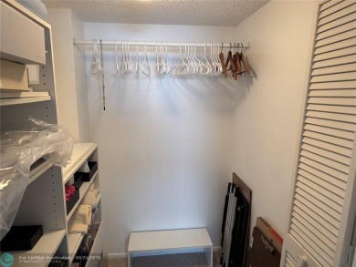 Convenient first floor unit condo in the tropical Palm Aire on Palm-Aire Country Club and Resort - The Oaks in Florida - for sale on GolfHomes.com, golf home, golf lot