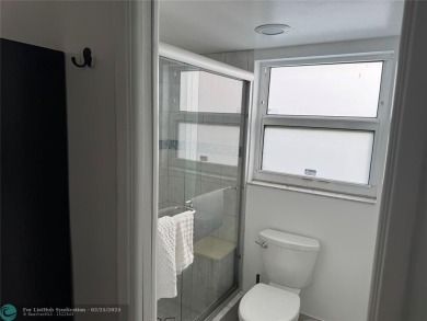 Convenient first floor unit condo in the tropical Palm Aire on Palm-Aire Country Club and Resort - The Oaks in Florida - for sale on GolfHomes.com, golf home, golf lot