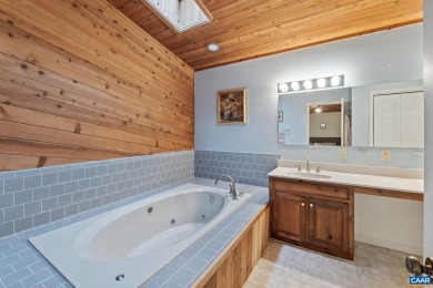 Step inside this one-level 3 bedroom, 2.5 bath Mid-Century on Lake Monticello Golf Course in Virginia - for sale on GolfHomes.com, golf home, golf lot