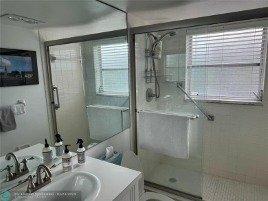 Convenient first floor unit condo in the tropical Palm Aire on Palm-Aire Country Club and Resort - The Oaks in Florida - for sale on GolfHomes.com, golf home, golf lot