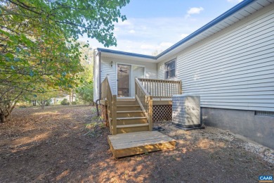 Step inside this one-level 3 bedroom, 2.5 bath Mid-Century on Lake Monticello Golf Course in Virginia - for sale on GolfHomes.com, golf home, golf lot