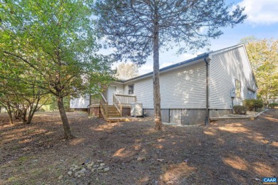 Step inside this one-level 3 bedroom, 2.5 bath Mid-Century on Lake Monticello Golf Course in Virginia - for sale on GolfHomes.com, golf home, golf lot