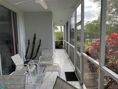 Convenient first floor unit condo in the tropical Palm Aire on Palm-Aire Country Club and Resort - The Oaks in Florida - for sale on GolfHomes.com, golf home, golf lot