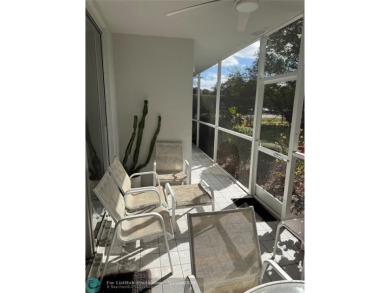 Convenient first floor unit condo in the tropical Palm Aire on Palm-Aire Country Club and Resort - The Oaks in Florida - for sale on GolfHomes.com, golf home, golf lot