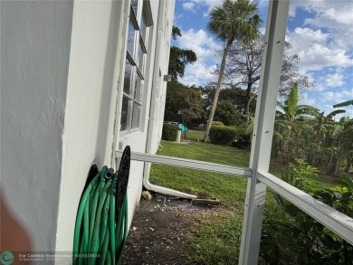 Convenient first floor unit condo in the tropical Palm Aire on Palm-Aire Country Club and Resort - The Oaks in Florida - for sale on GolfHomes.com, golf home, golf lot