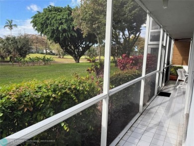 Convenient first floor unit condo in the tropical Palm Aire on Palm-Aire Country Club and Resort - The Oaks in Florida - for sale on GolfHomes.com, golf home, golf lot