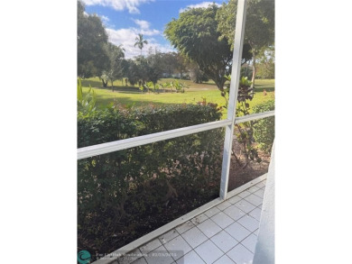Convenient first floor unit condo in the tropical Palm Aire on Palm-Aire Country Club and Resort - The Oaks in Florida - for sale on GolfHomes.com, golf home, golf lot