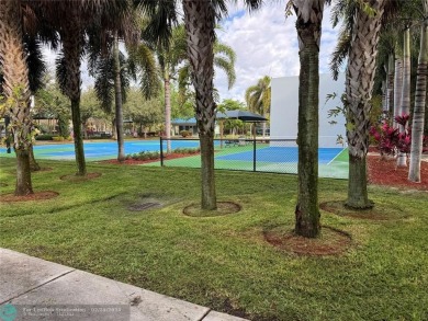 Convenient first floor unit condo in the tropical Palm Aire on Palm-Aire Country Club and Resort - The Oaks in Florida - for sale on GolfHomes.com, golf home, golf lot
