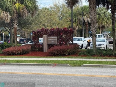 Convenient first floor unit condo in the tropical Palm Aire on Palm-Aire Country Club and Resort - The Oaks in Florida - for sale on GolfHomes.com, golf home, golf lot