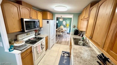 This stunning manufactured home boasts 2 bedrooms and 2 on Riverbend Golf and Country Club in Florida - for sale on GolfHomes.com, golf home, golf lot