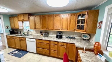 This stunning manufactured home boasts 2 bedrooms and 2 on Riverbend Golf and Country Club in Florida - for sale on GolfHomes.com, golf home, golf lot