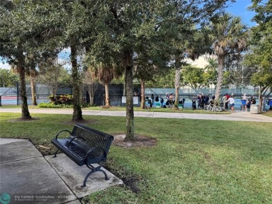 Convenient first floor unit condo in the tropical Palm Aire on Palm-Aire Country Club and Resort - The Oaks in Florida - for sale on GolfHomes.com, golf home, golf lot