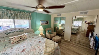 This stunning manufactured home boasts 2 bedrooms and 2 on Riverbend Golf and Country Club in Florida - for sale on GolfHomes.com, golf home, golf lot