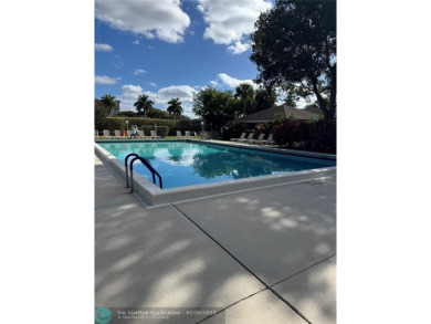 Convenient first floor unit condo in the tropical Palm Aire on Palm-Aire Country Club and Resort - The Oaks in Florida - for sale on GolfHomes.com, golf home, golf lot
