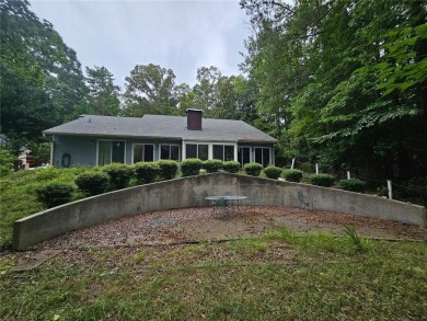 This 3 bed, 2 bath single-story home sits on the smaller fishing on Fairfield Plantation Golf and Country Club in Georgia - for sale on GolfHomes.com, golf home, golf lot