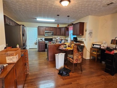This 3 bed, 2 bath single-story home sits on the smaller fishing on Fairfield Plantation Golf and Country Club in Georgia - for sale on GolfHomes.com, golf home, golf lot