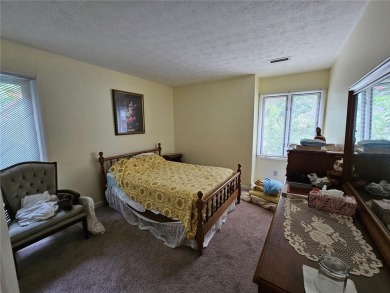 This 3 bed, 2 bath single-story home sits on the smaller fishing on Fairfield Plantation Golf and Country Club in Georgia - for sale on GolfHomes.com, golf home, golf lot
